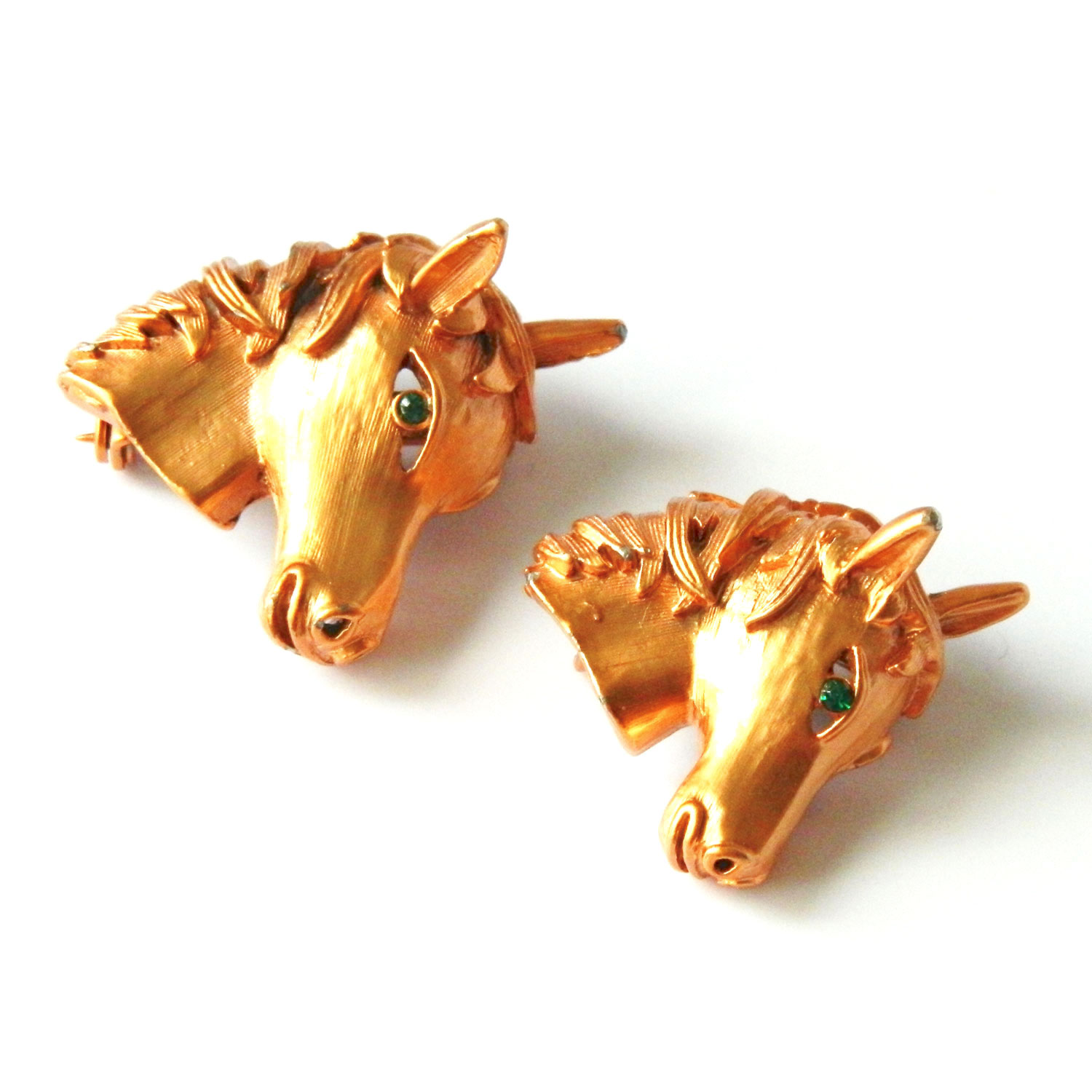 Pair of horse head brooches