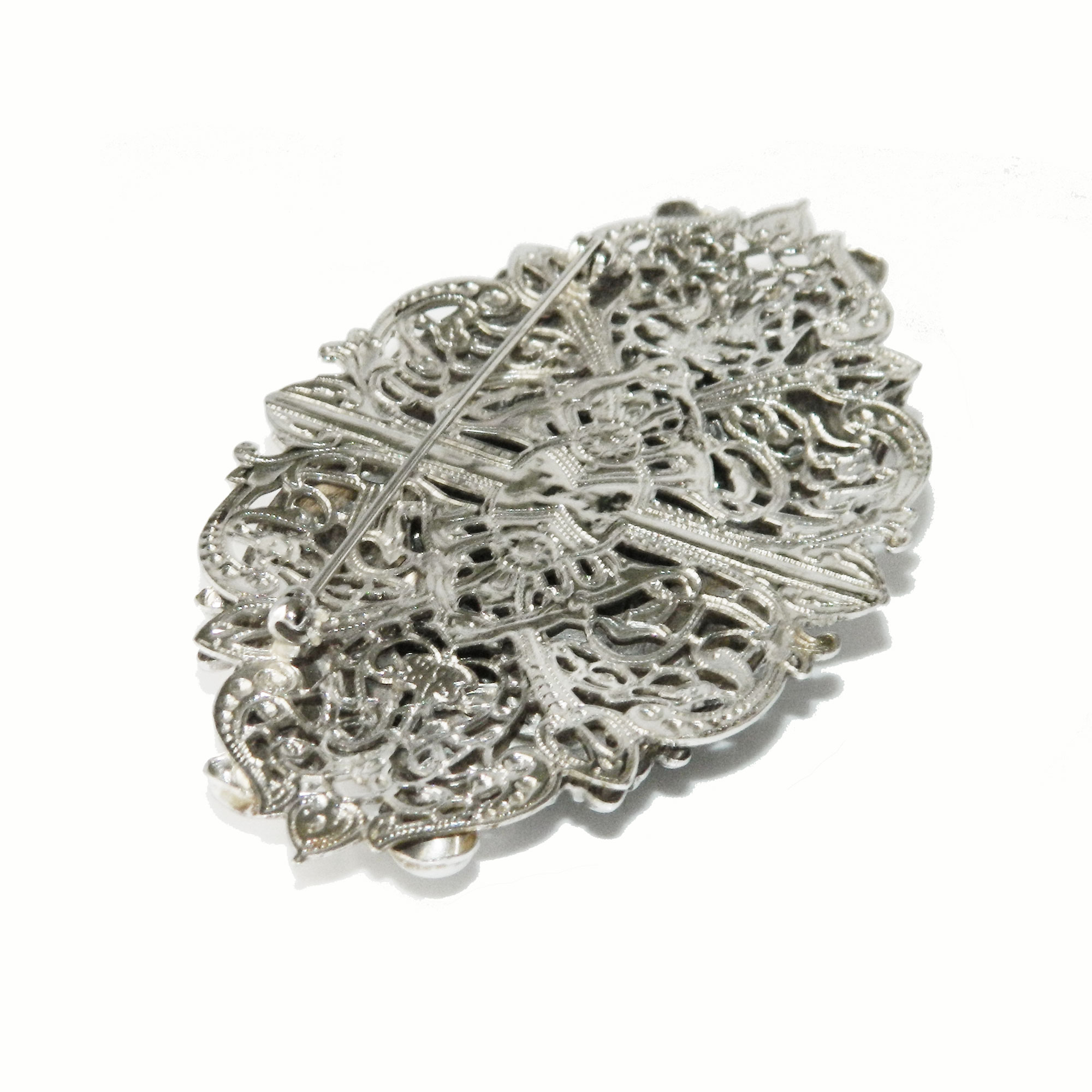Silver metal floral brooch