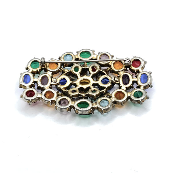 Open backed crystal brooch