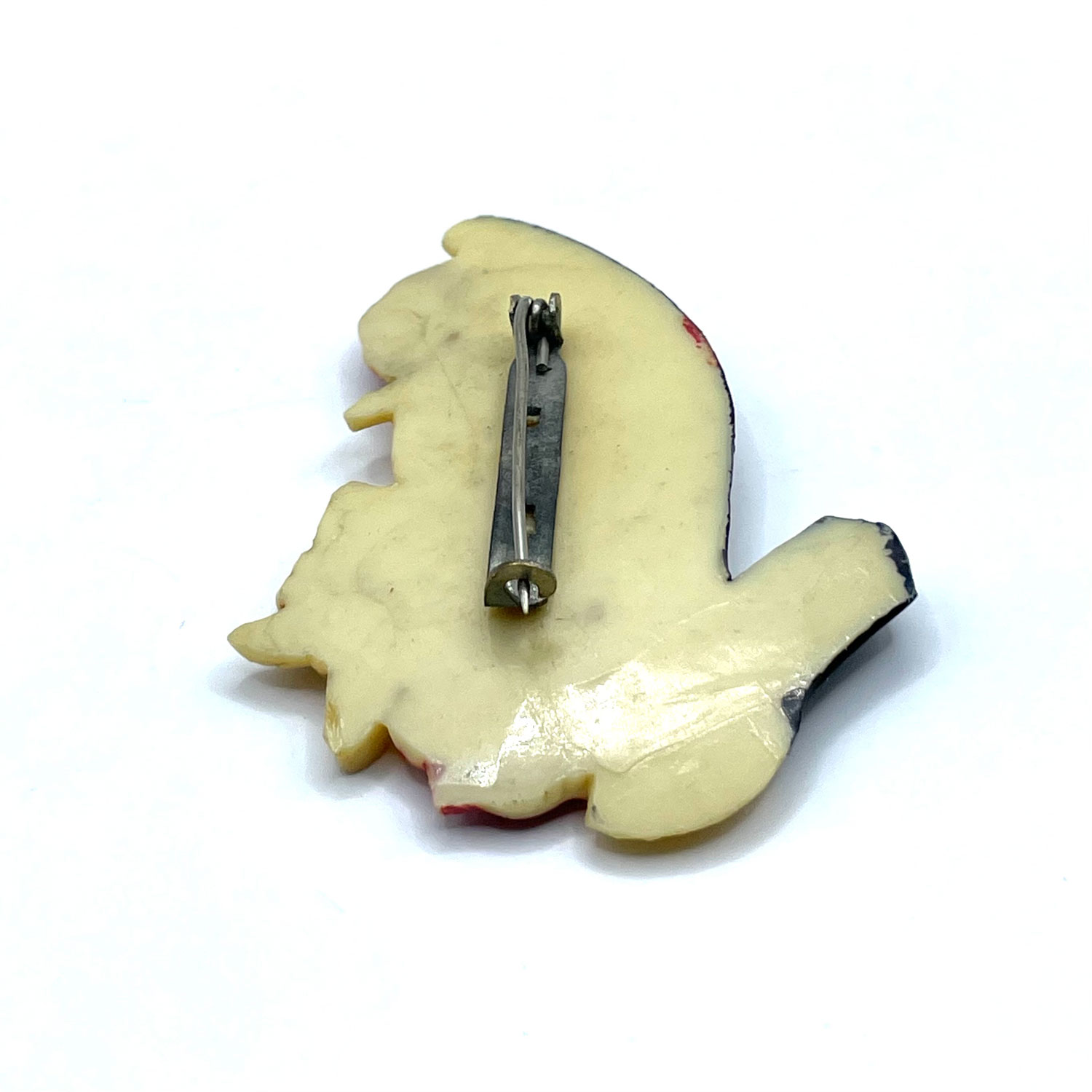 1930s celluloid dog in shoe rhinestone brooch
