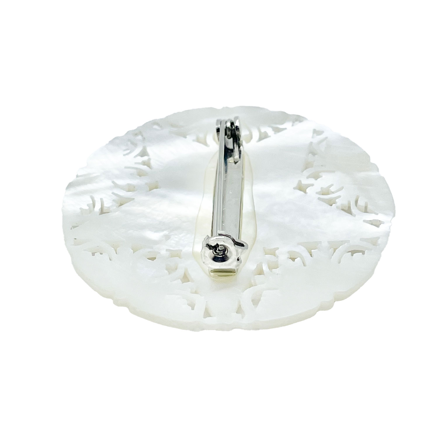 Hand carved mother of pearl brooch