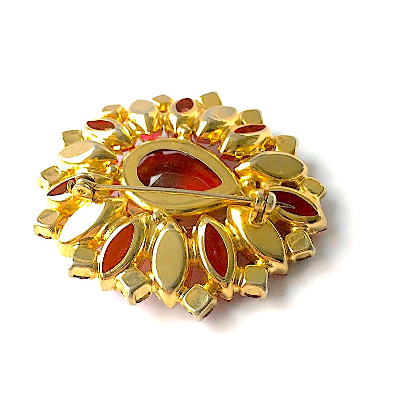red rhinestone brooch