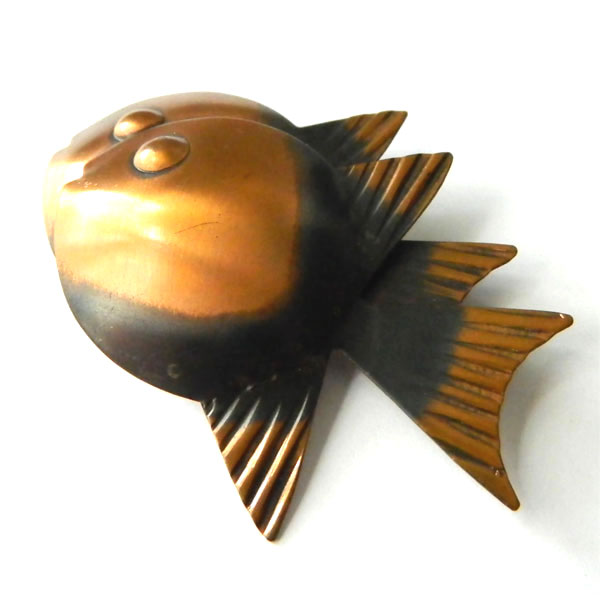 Rebajes copper brooch