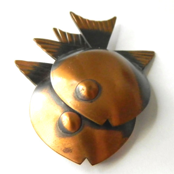 Rebajes copper brooch