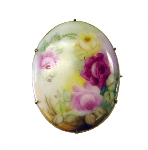 Antique ceramic brooch beautifully hand painted with roses