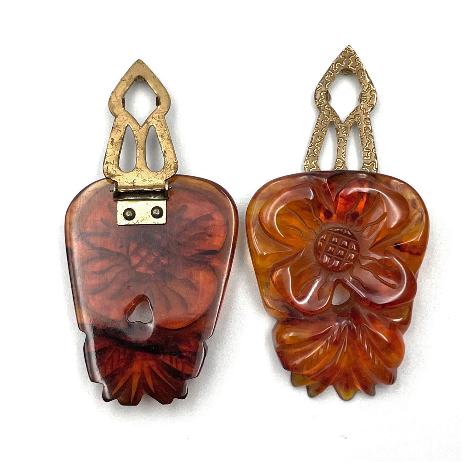 carved bakelite dress clips