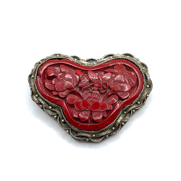 Carved cinnabar dress clip