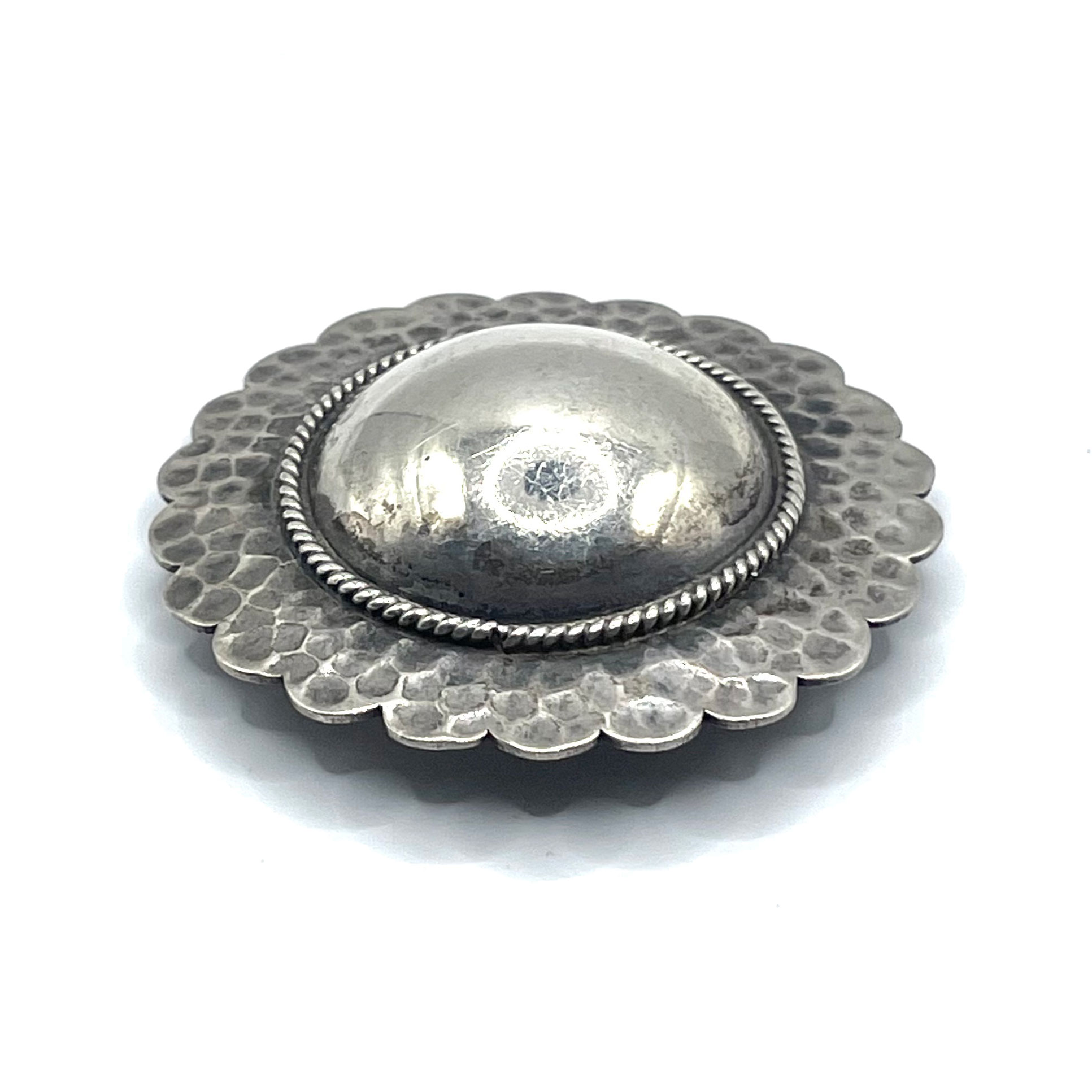 Sun motif sterling brooch