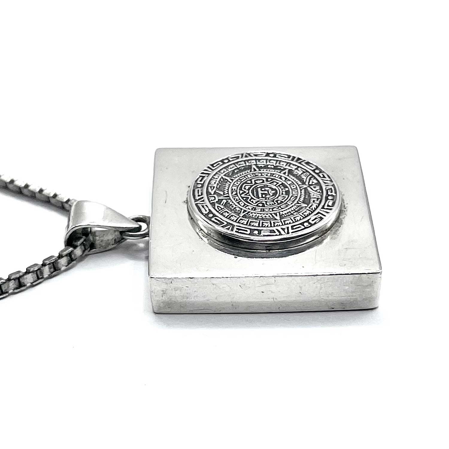 Mexican silver Aztec calendar pendant